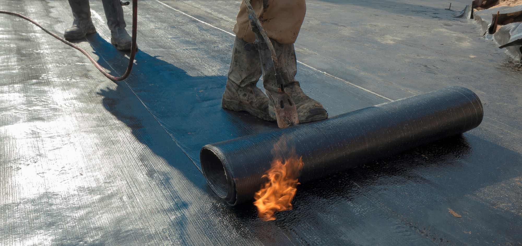 Man waterproofing cement with fire