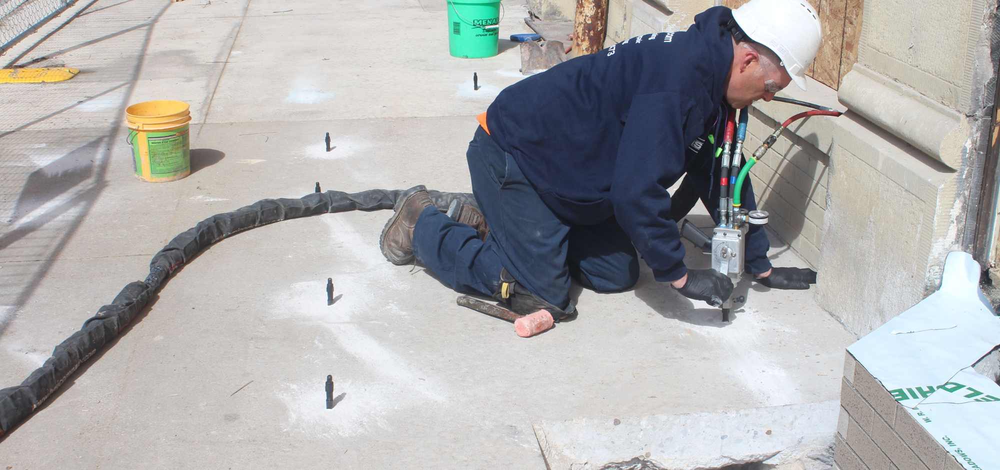 man fixing cement with foam