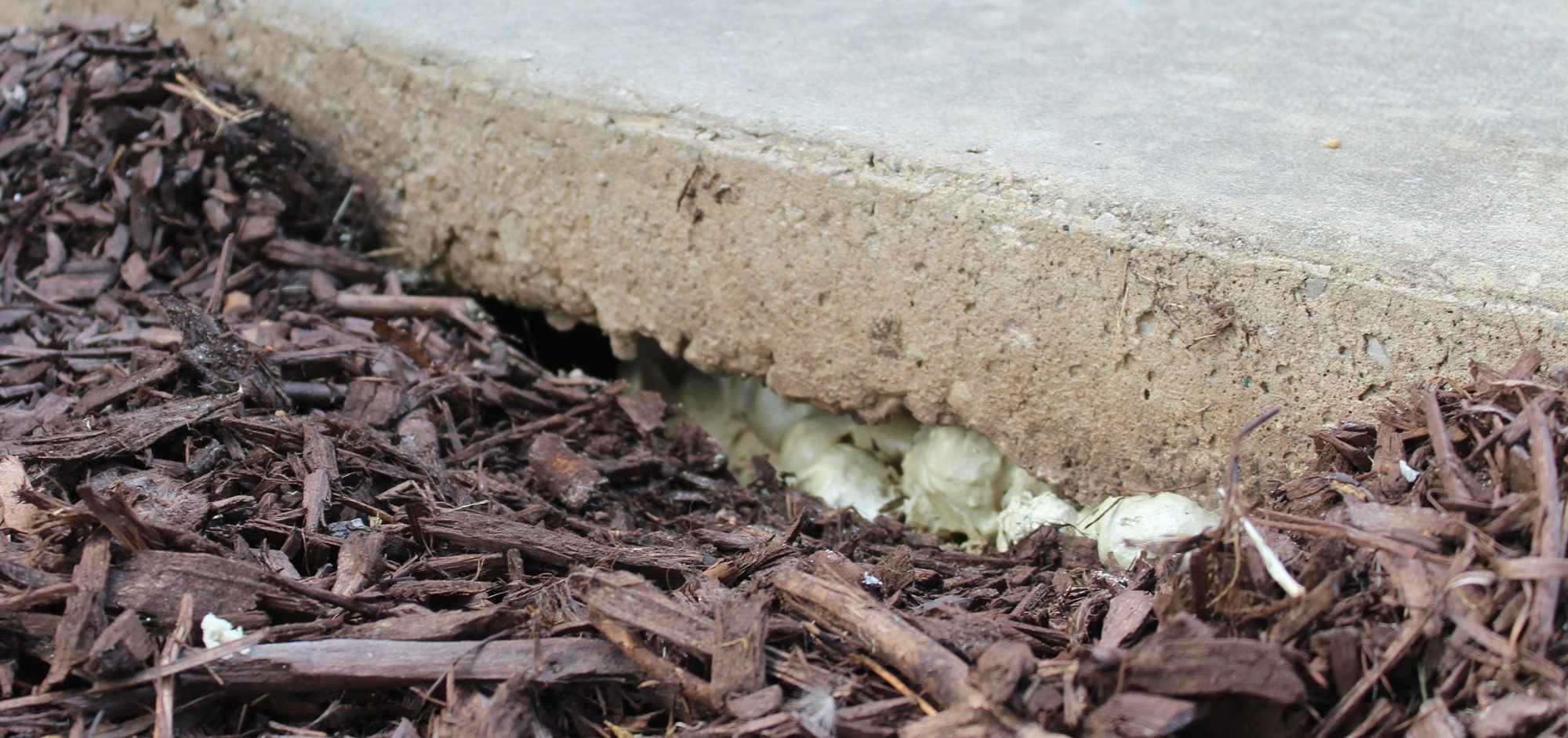 Foam under sidewalk to level sidewalk