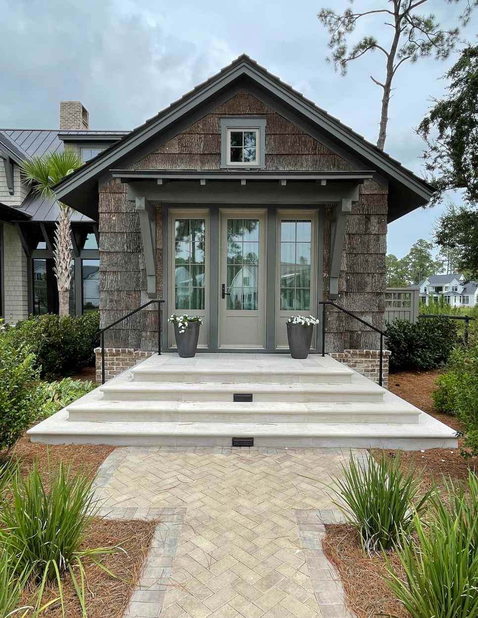 Cement stairs leading up to house doors